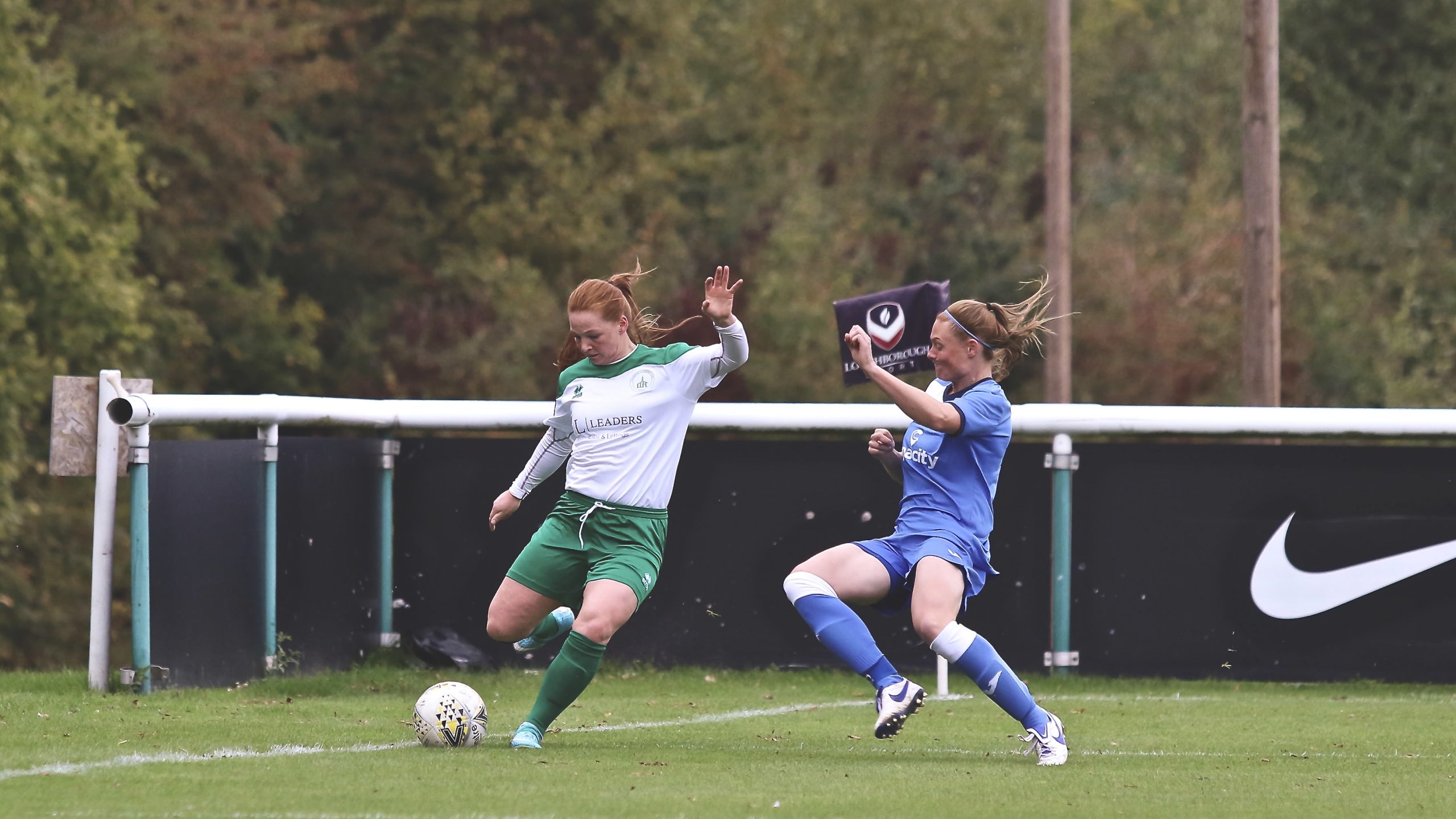Jade Widdow puts on a cross as the Loughborough player goes in to block it.
