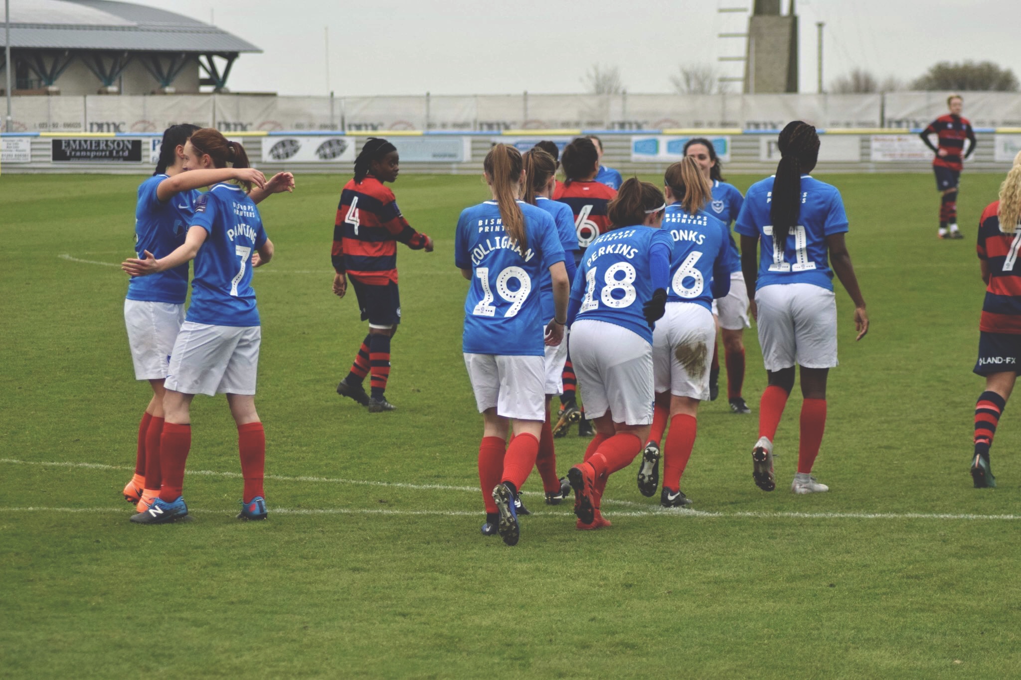 The Portsmouth players celebrate with Panting after she puts them 1-0 ahead. Photo by Stephen Cummings.