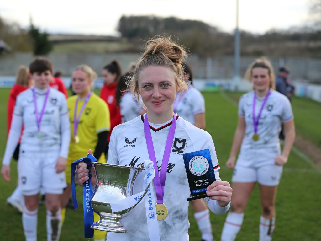 Laura Mitchell with County Cup Final trophy and Player of the match award